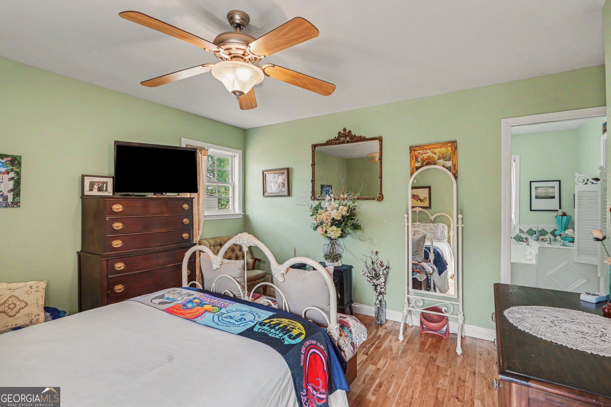 117 Dobbins Mill Road Griffin, GA 30223 - Photo 16 of 27 a bedroom that has a bed and a tv
