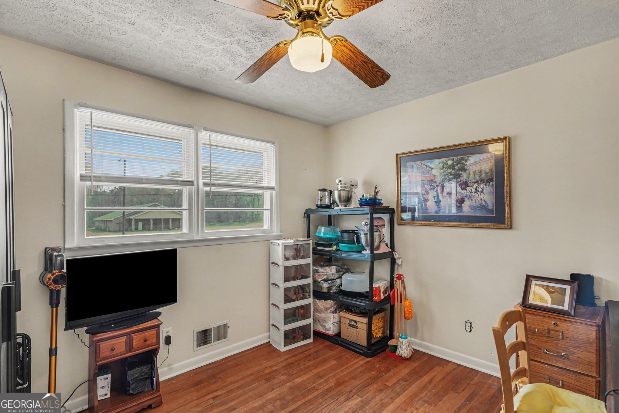 117 Dobbins Mill Road Griffin, GA 30223 - Photo 19 of 27 a view of a workspace with furniture and a window