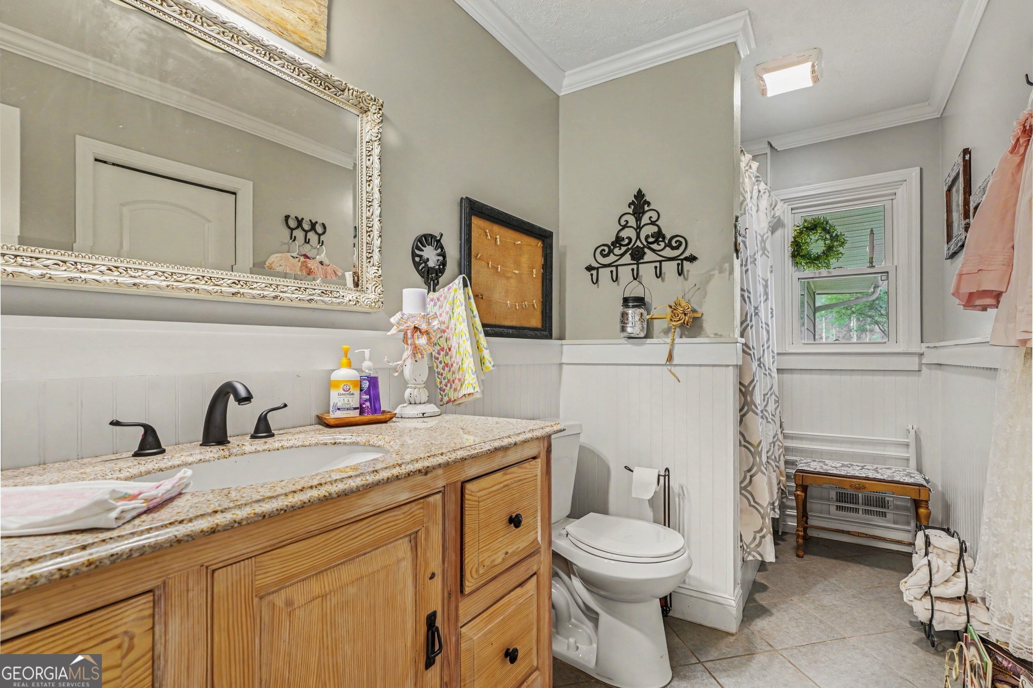 117 Dobbins Mill Road Griffin, GA 30223 - Photo 20 of 27 a bathroom with a granite countertop toilet sink and mirror