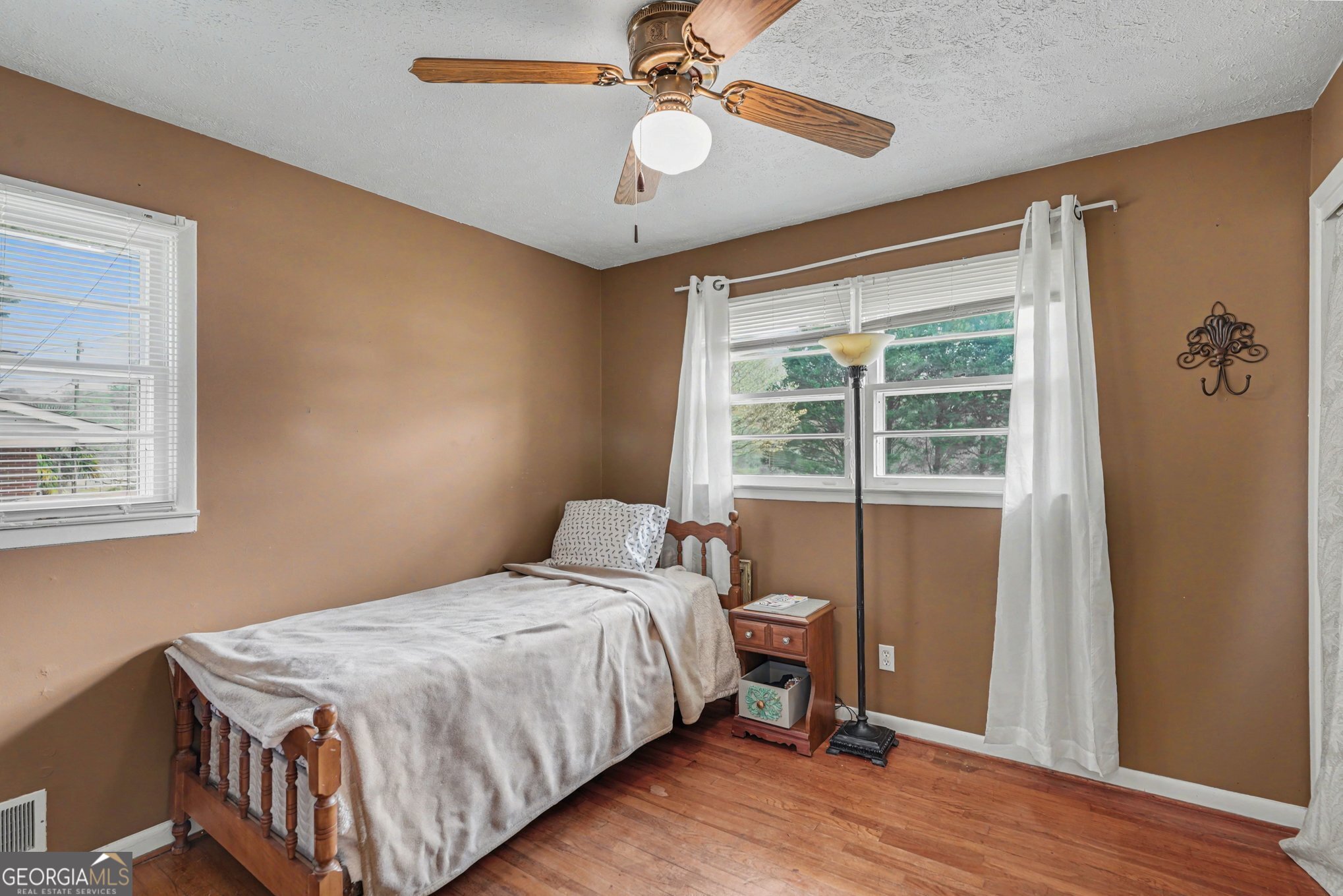 117 Dobbins Mill Road Griffin, GA 30223 - Photo 21 of 27 a bedroom with a bed and a window