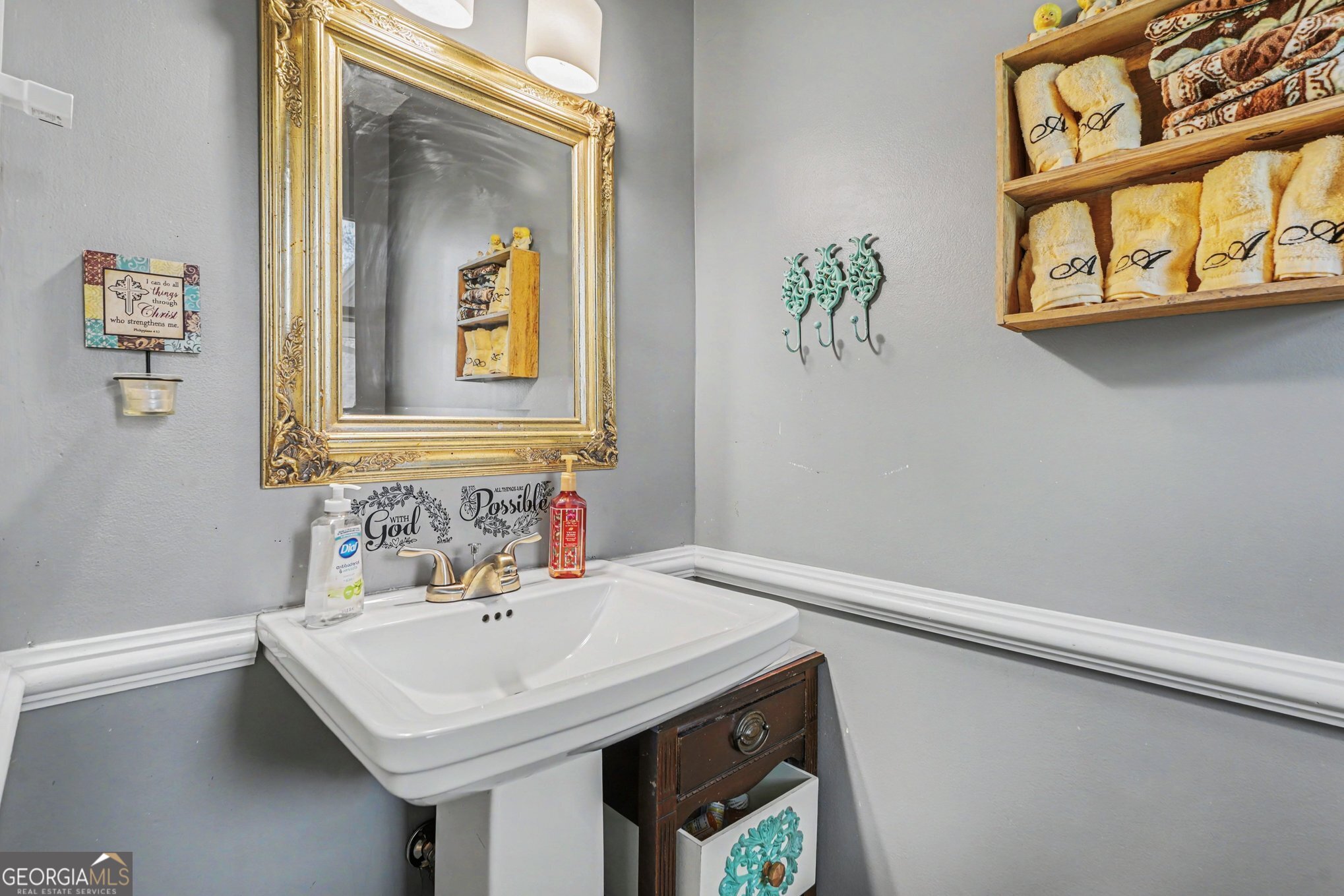 117 Dobbins Mill Road Griffin, GA 30223 - Photo 23 of 27 a bathroom with a sink and a mirror