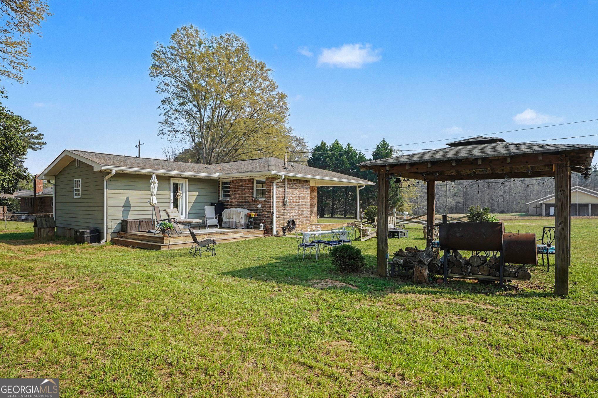 117 Dobbins Mill Road Griffin, GA 30223 - Photo 26 of 27 a view of a house with a patio