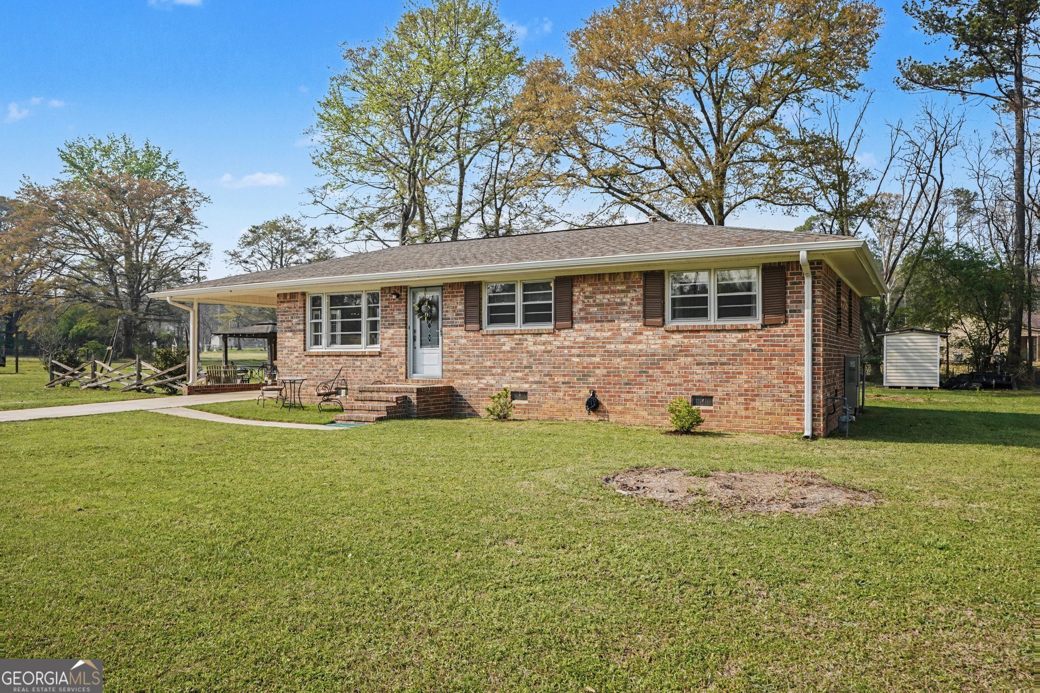 117 Dobbins Mill Road Griffin, GA 30223 - Photo 3 of 27 a front view of house with yard and green space