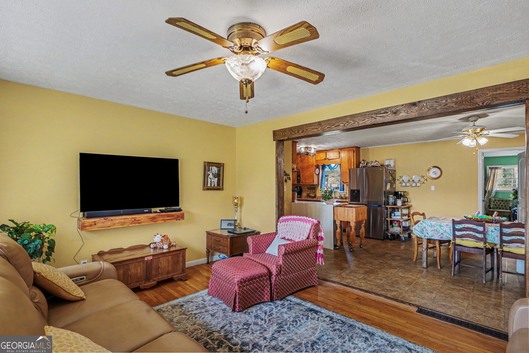 117 Dobbins Mill Road Griffin, GA 30223 - Photo 5 of 27 a living room with furniture and a flat screen tv
