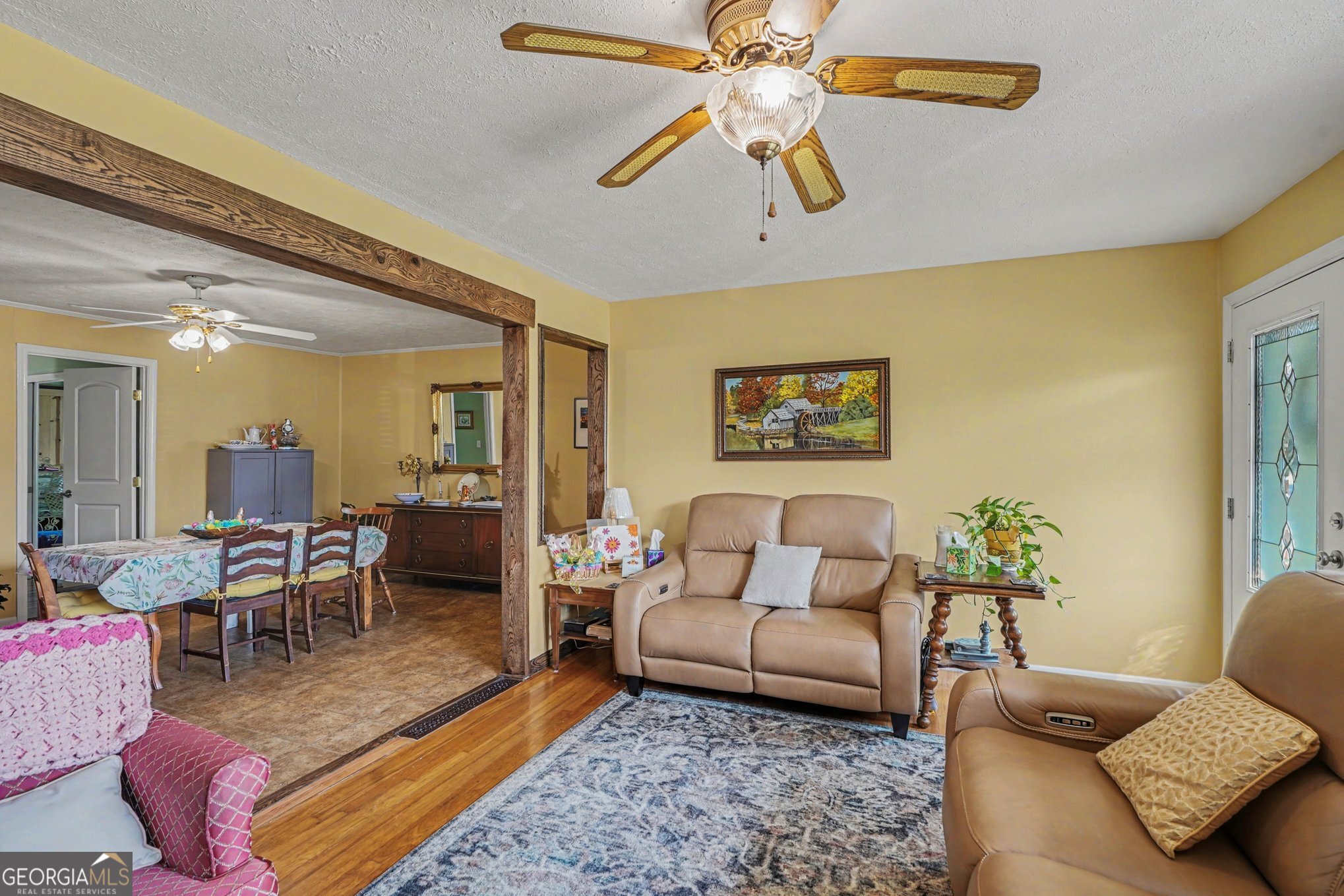 117 Dobbins Mill Road Griffin, GA 30223 - Photo 7 of 27 a living room with furniture and wooden floor