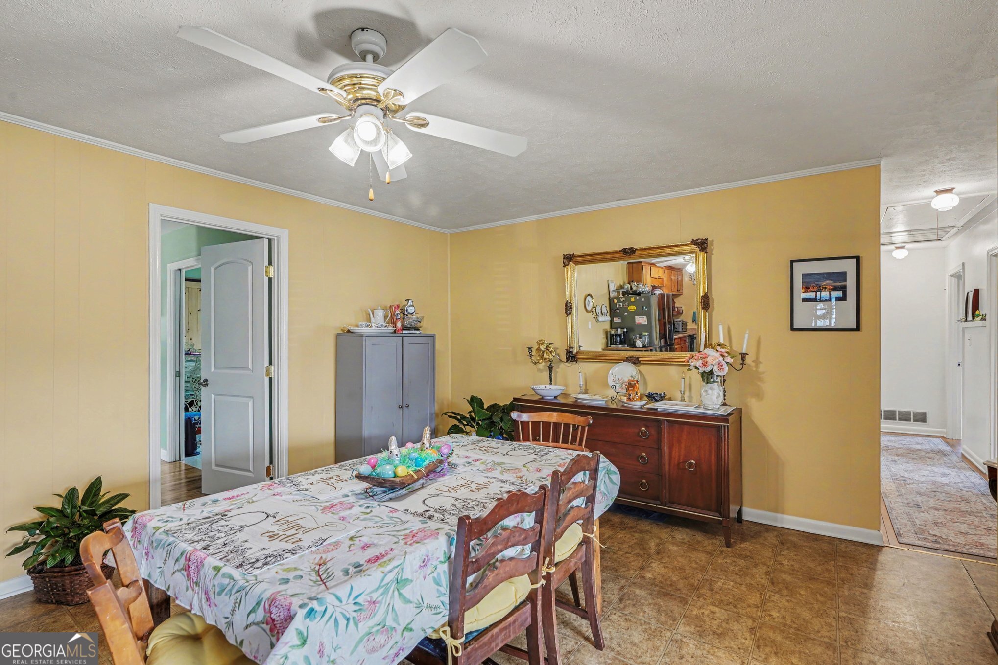 117 Dobbins Mill Road Griffin, GA 30223 - Photo 8 of 27 a bed room with a bed and a chandelier