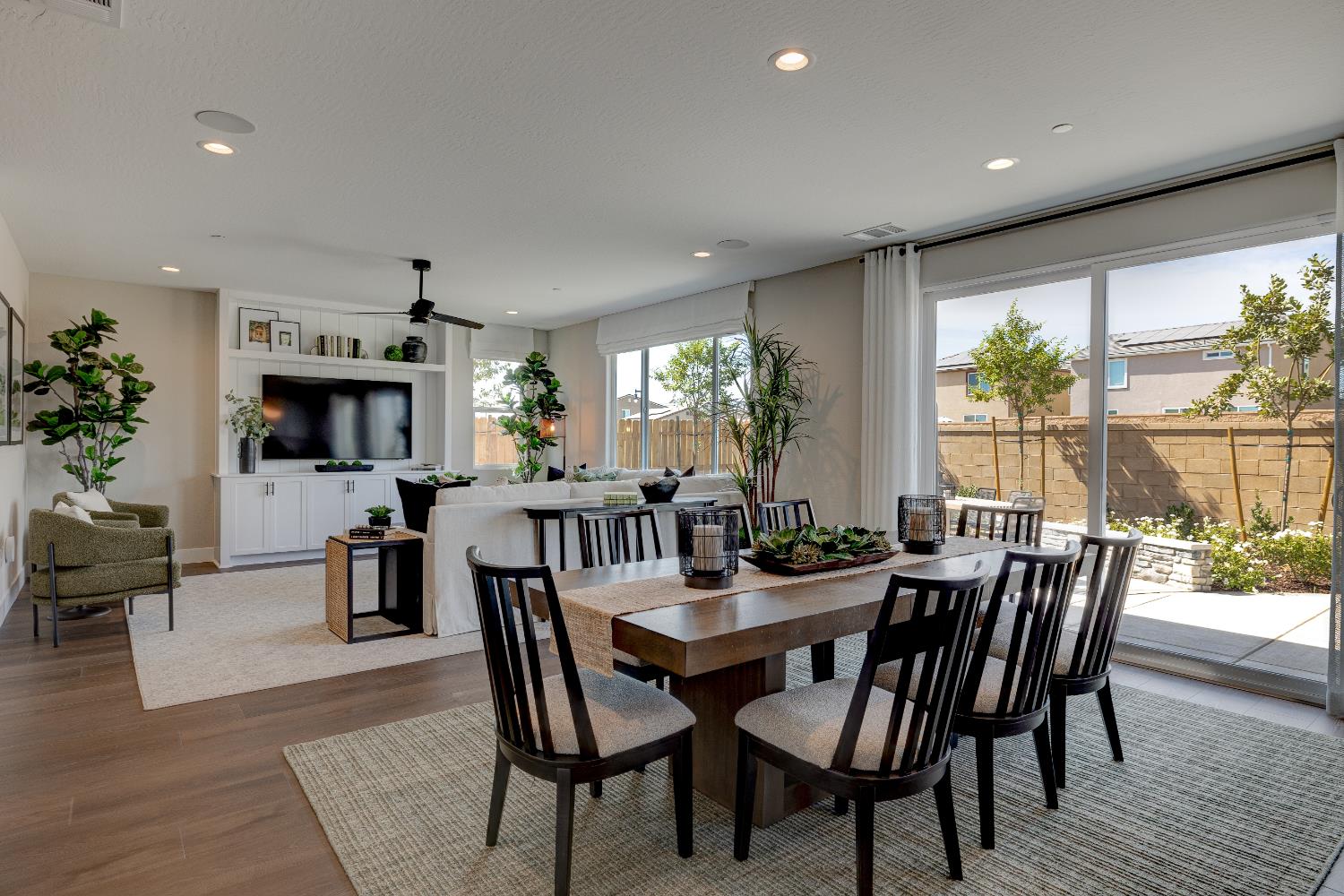 1179 Maclure Avenue Madera, CA 93636 - Photo 11 of 36 a view of a dining room with furniture window and wooden floor