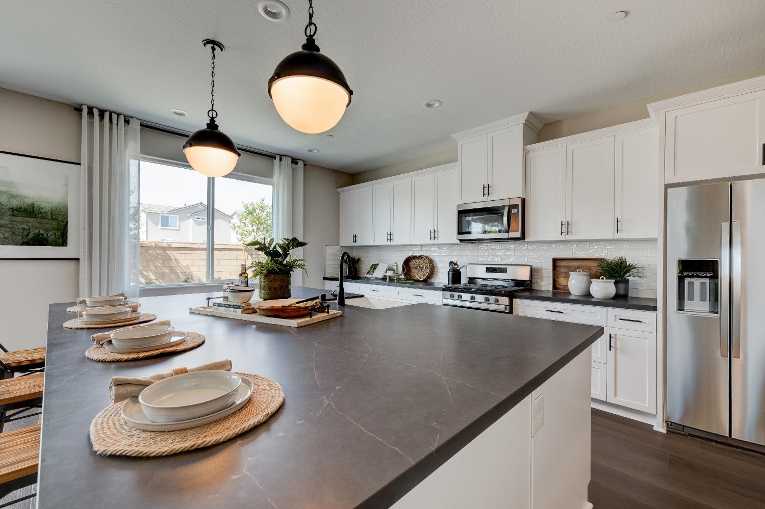 1179 Maclure Avenue Madera, CA 93636 - Photo 16 of 36 a kitchen with a sink appliances and cabinets