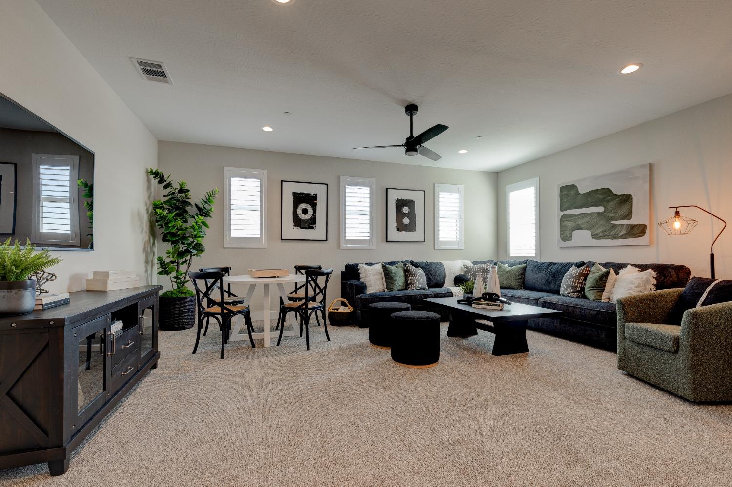 1179 Maclure Avenue Madera, CA 93636 - Photo 19 of 36 a living room with furniture windows and a flat screen tv