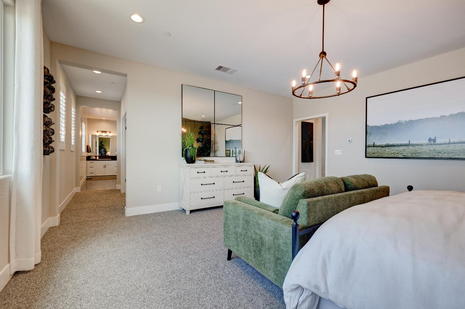 1179 Maclure Avenue Madera, CA 93636 - Photo 22 of 36 a living room with furniture kitchen view and a chandelier