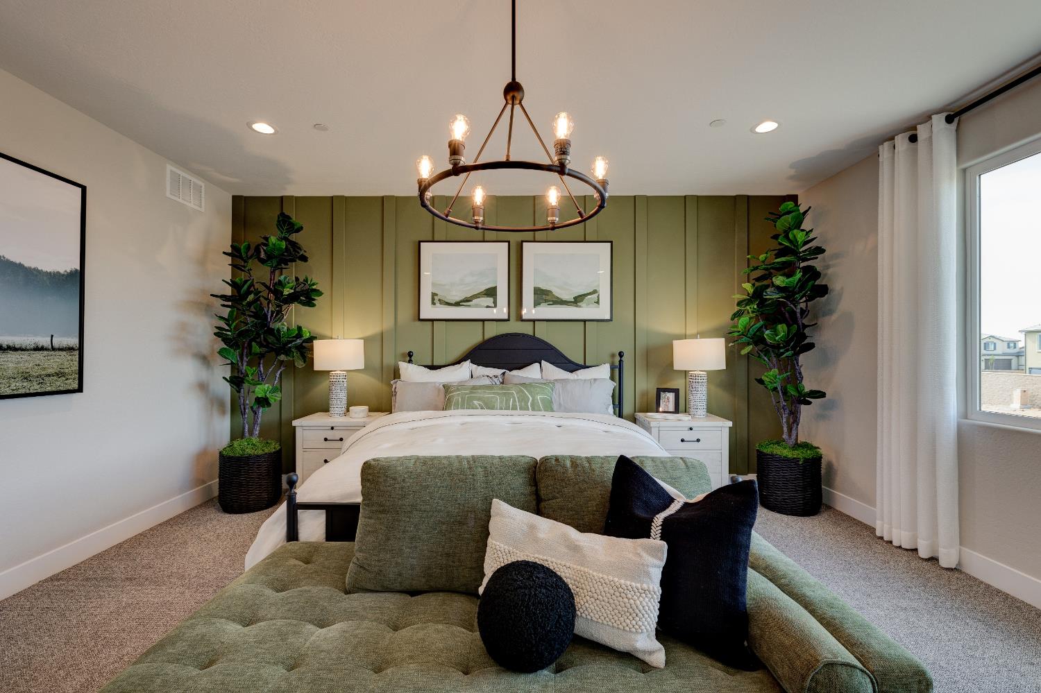 1179 Maclure Avenue Madera, CA 93636 - Photo 24 of 36 a bedroom with a bed and a chandelier