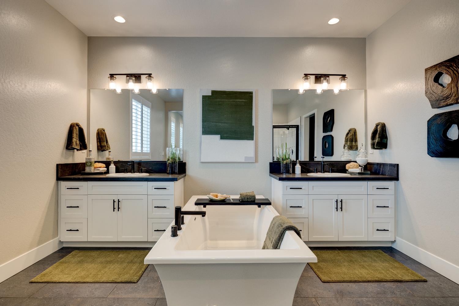 1179 Maclure Avenue Madera, CA 93636 - Photo 28 of 36 a bathroom with a double vanity sink a mirror and bathtub