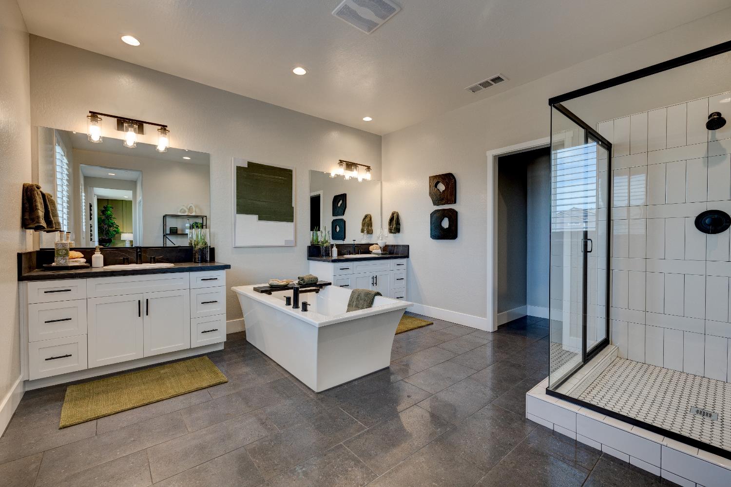 1179 Maclure Avenue Madera, CA 93636 - Photo 30 of 36 a spacious en suite bathroom with a double vanity sink a mirror and shower