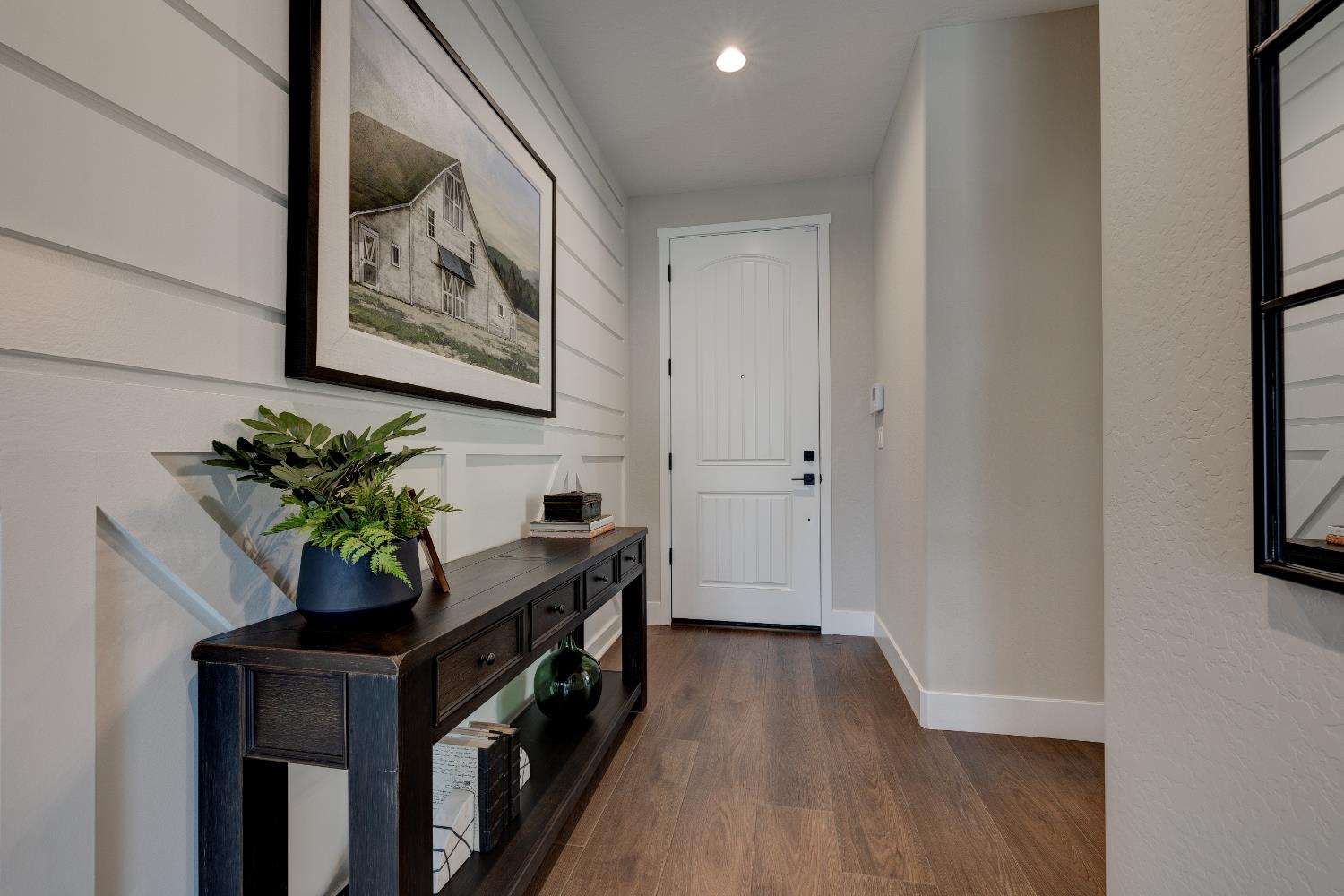 1179 Maclure Avenue Madera, CA 93636 - Photo 3 of 36 a view of bathroom with a potted plant on a counter and a window