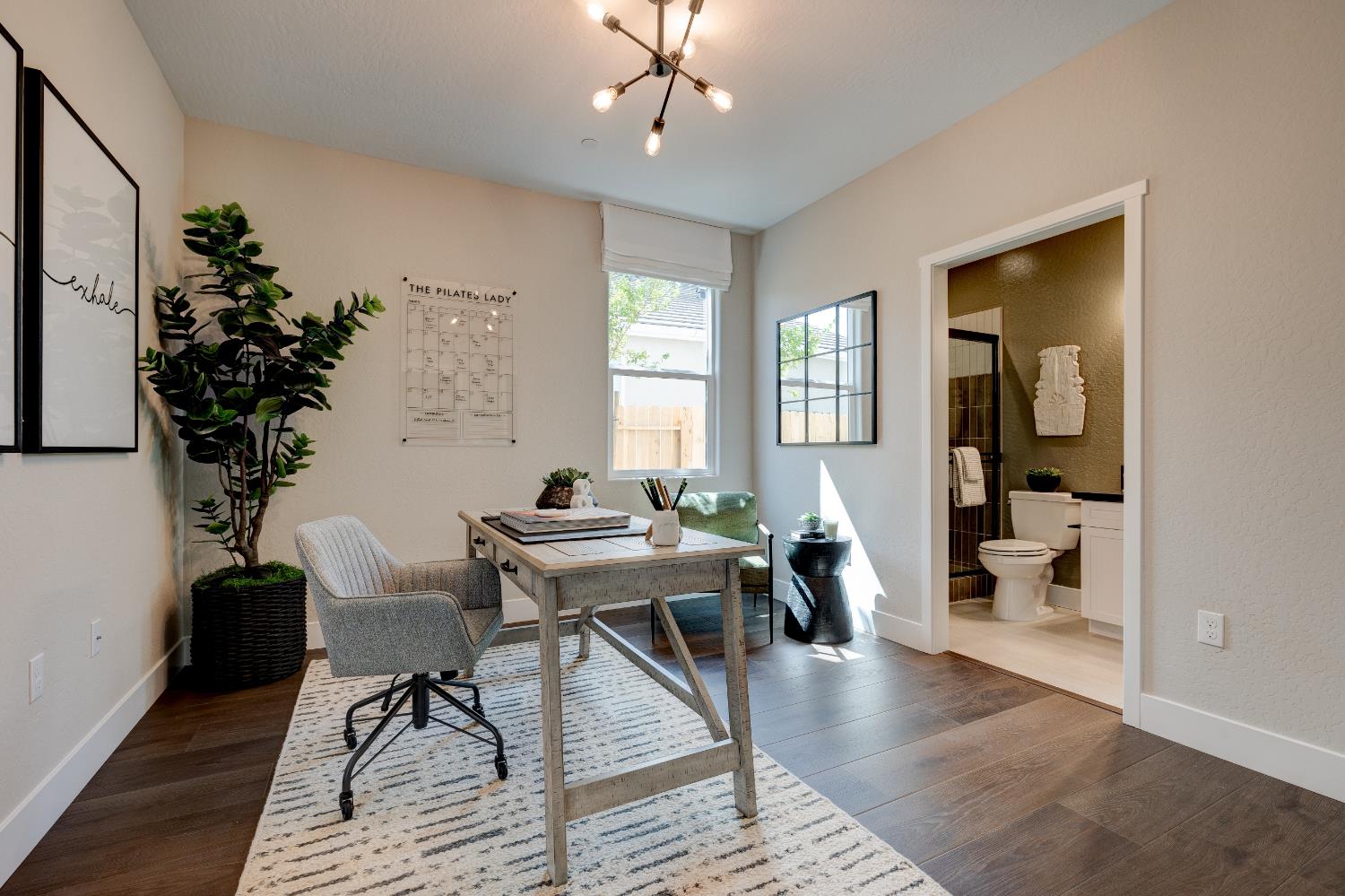 1179 Maclure Avenue Madera, CA 93636 - Photo 4 of 36 a view of a livingroom with furniture and hardwood floor