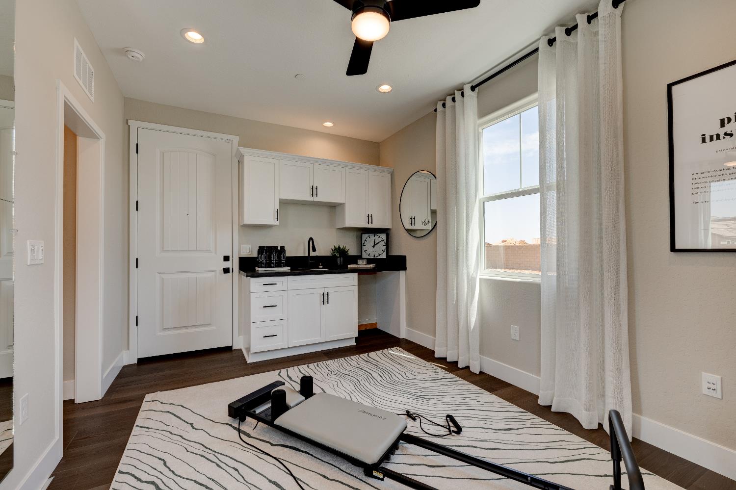 1179 Maclure Avenue Madera, CA 93636 - Photo 5 of 36 a kitchen with a refrigerator and white cabinets