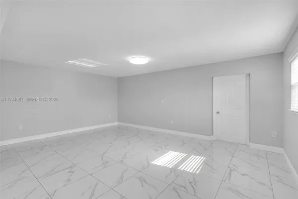 a view of an empty room and window