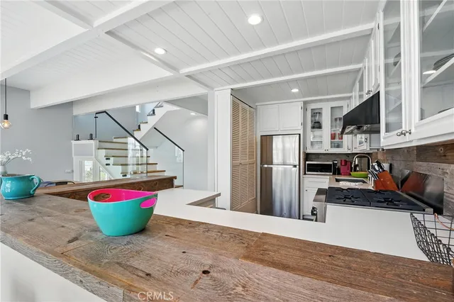 a bedroom with furniture and large windows