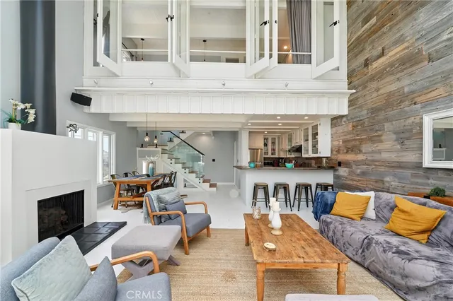 a kitchen with cabinets appliances a sink and a window