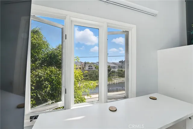 a kitchen with lots of counter top space and wooden floor