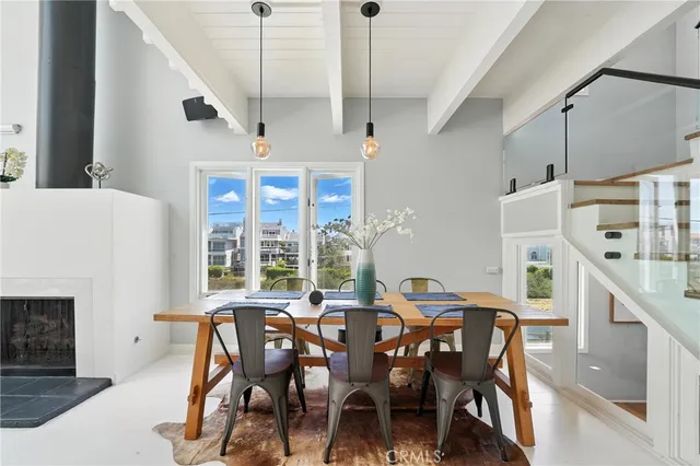 a balcony with table and chairs