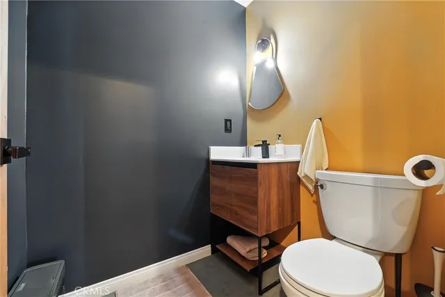 a bedroom with furniture and a large window