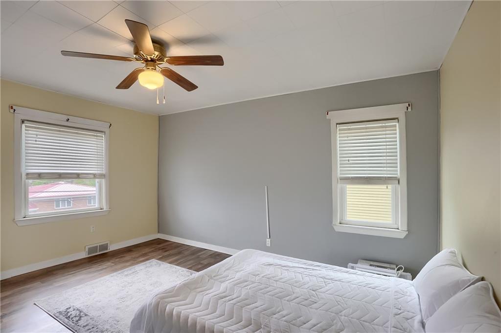 392 Reno Street Rochester, PA 15074 - Photo 19 of 41 a bedroom with a bed and a window