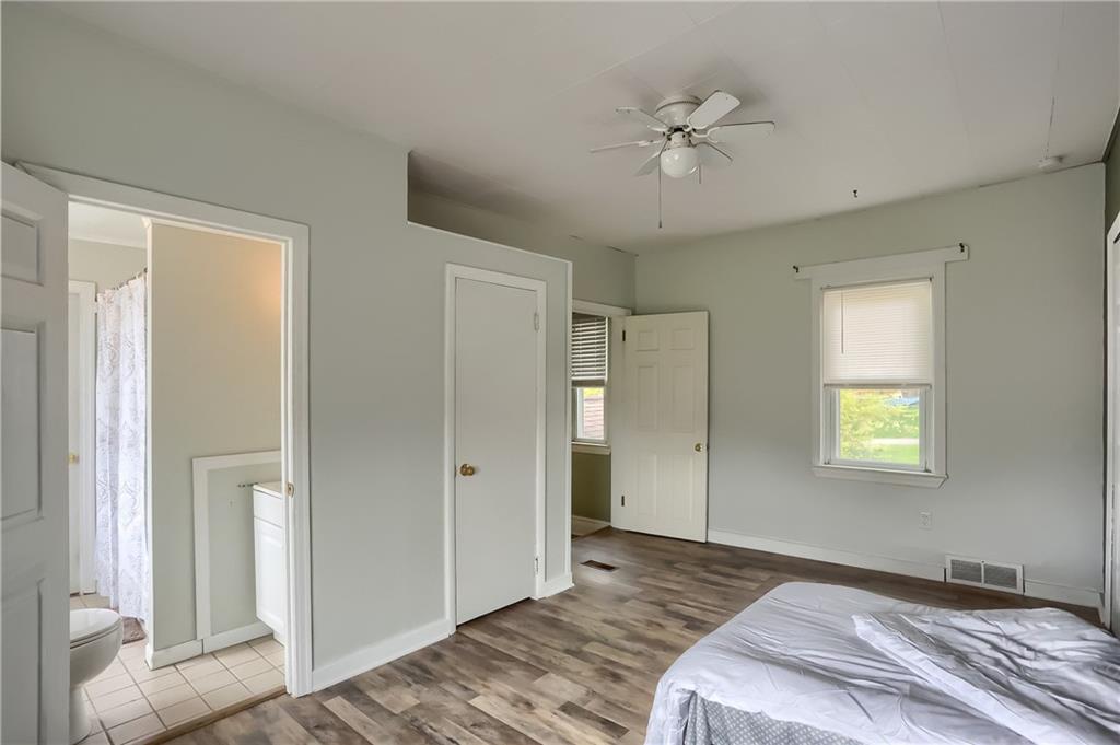 392 Reno Street Rochester, PA 15074 - Photo 25 of 41 a bedroom with a bed and a ceiling fan