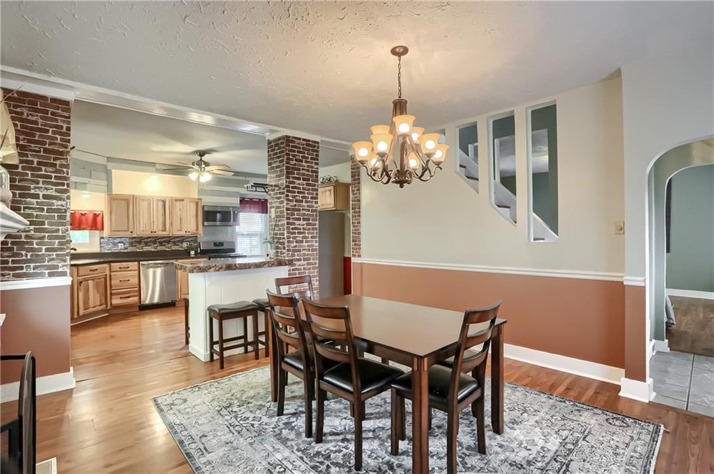 392 Reno Street Rochester, PA 15074 - Photo 10 of 41 a view of a dining room with furniture and wooden floor