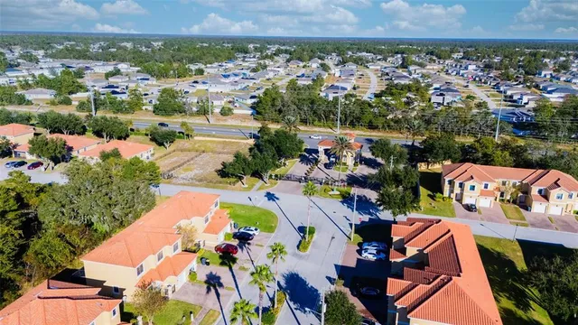an aerial view of a house and outdoor space