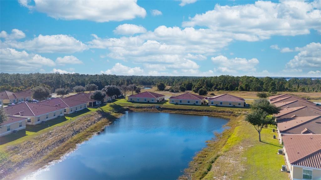 1736 Pacific Road Kissimmee, FL 34759 - Photo 22 of 42 a view of a swimming pool and lounge chairs