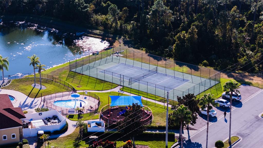 1736 Pacific Road Kissimmee, FL 34759 - Photo 24 of 42 an aerial view of a swimming pool patio and outdoor seating