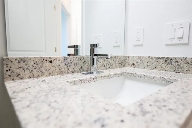 a bathroom with bathtub and vanity