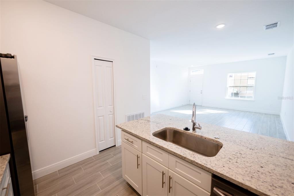 1736 Pacific Road Kissimmee, FL 34759 - Photo 5 of 42 a kitchen with a sink and cabinets