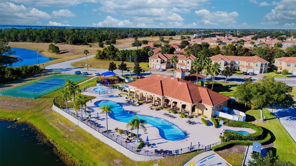 1736 Pacific Road Kissimmee, FL 34759 - Photo 6 of 42 an aerial view of a house with a swimming pool outdoor seating and yard