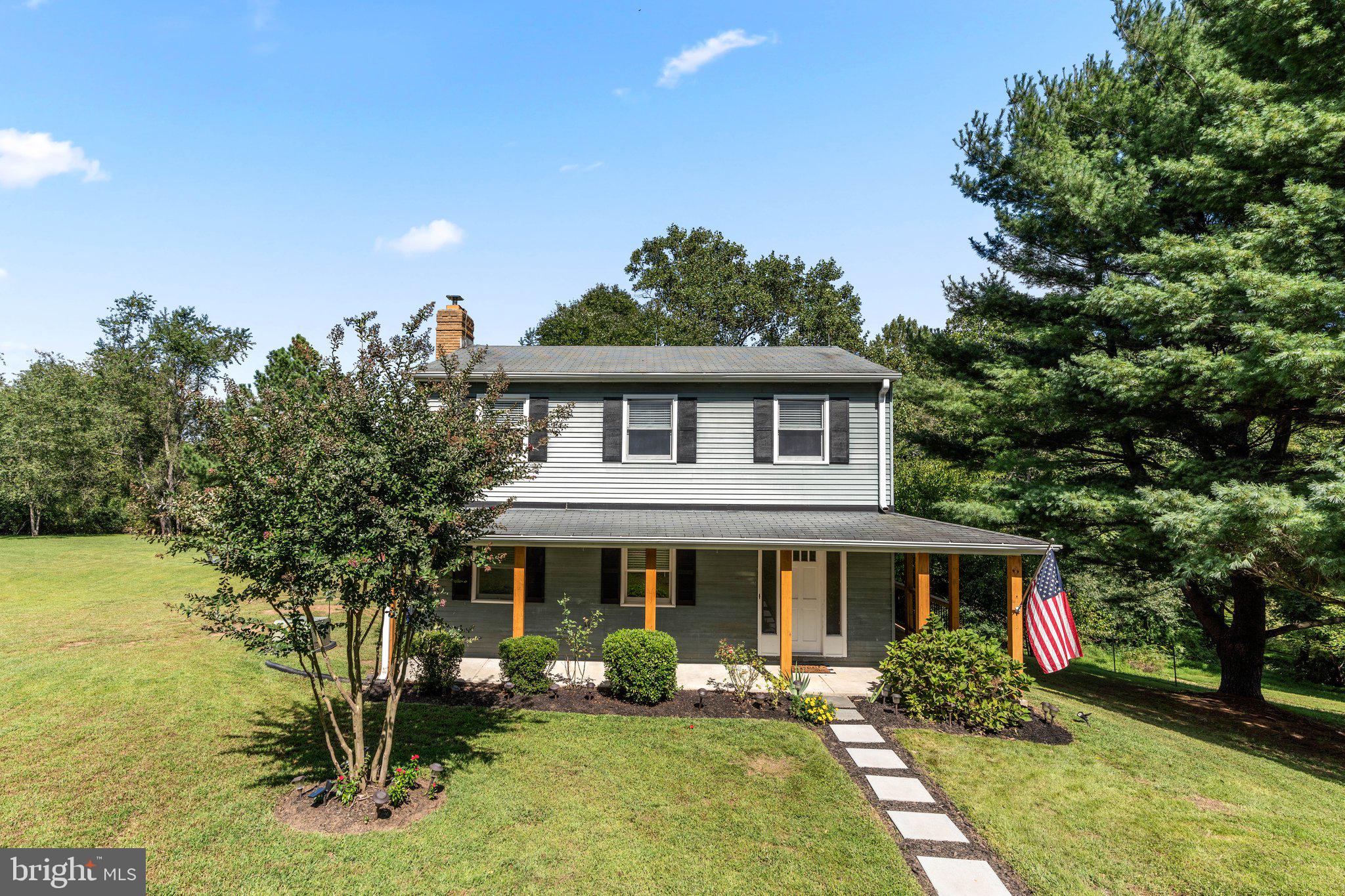 16111 Oursler Road Burtonsville, MD 20866 - Photo 1 of 1 a front view of a house with garden