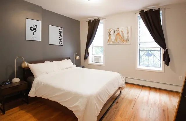 a large white bed in a white room