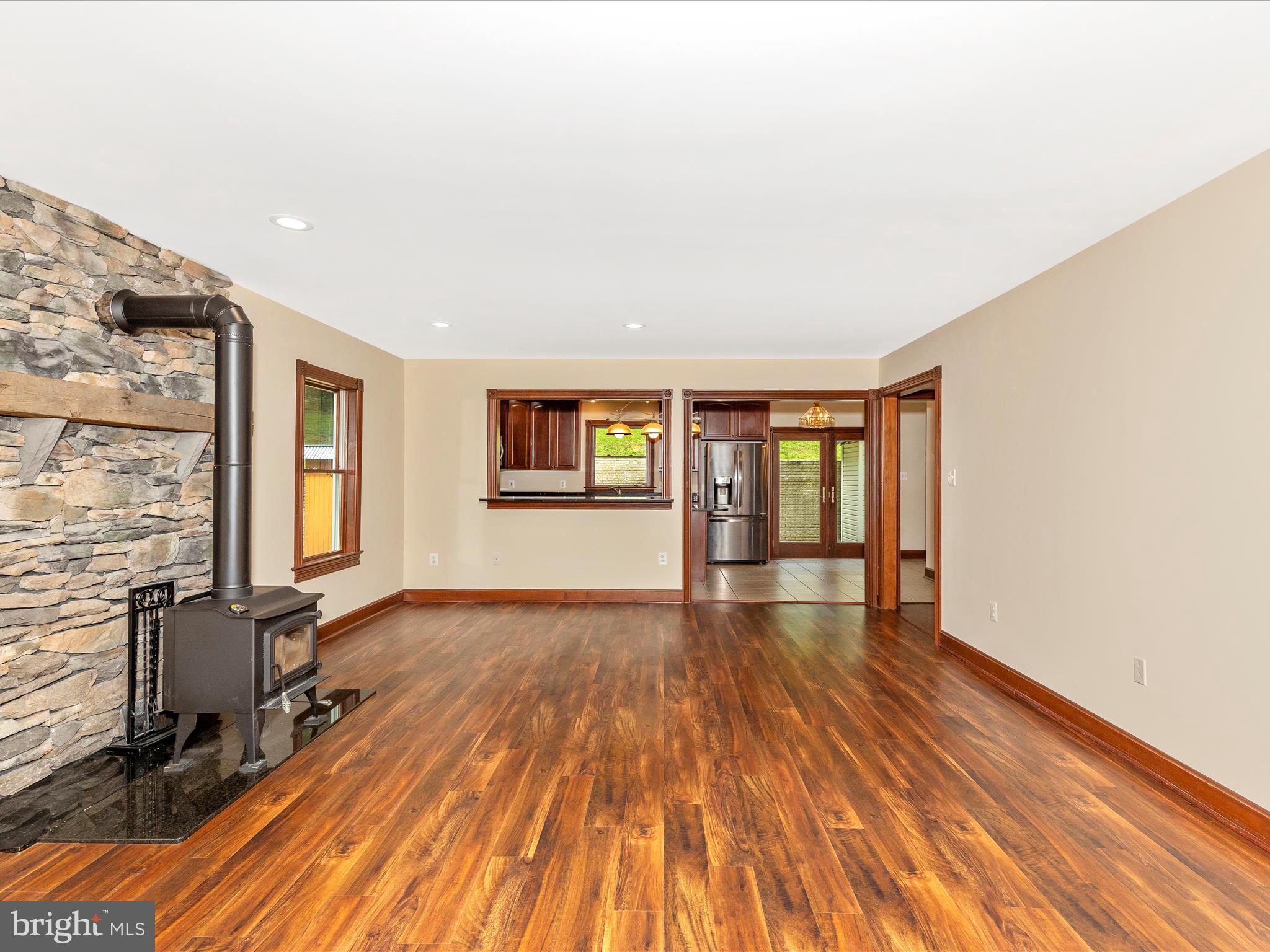 10433 Grindstone Run Road Myersville, MD 21773 - Photo 14 of 42 a view of an empty room with window and wooden floor
