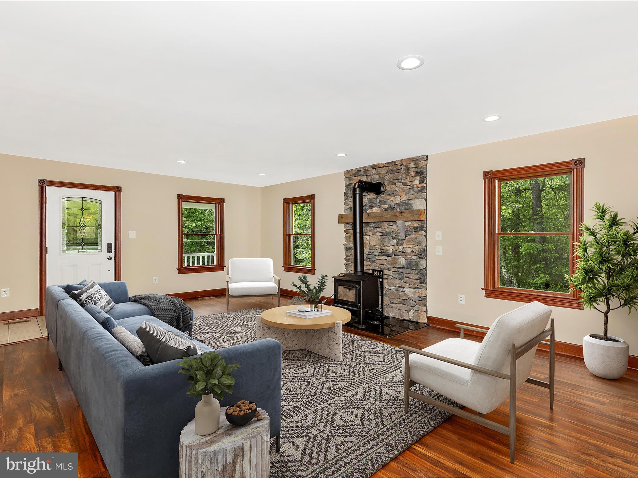 10433 Grindstone Run Road Myersville, MD 21773 - Photo 16 of 42 a living room with fireplace furniture and a large window