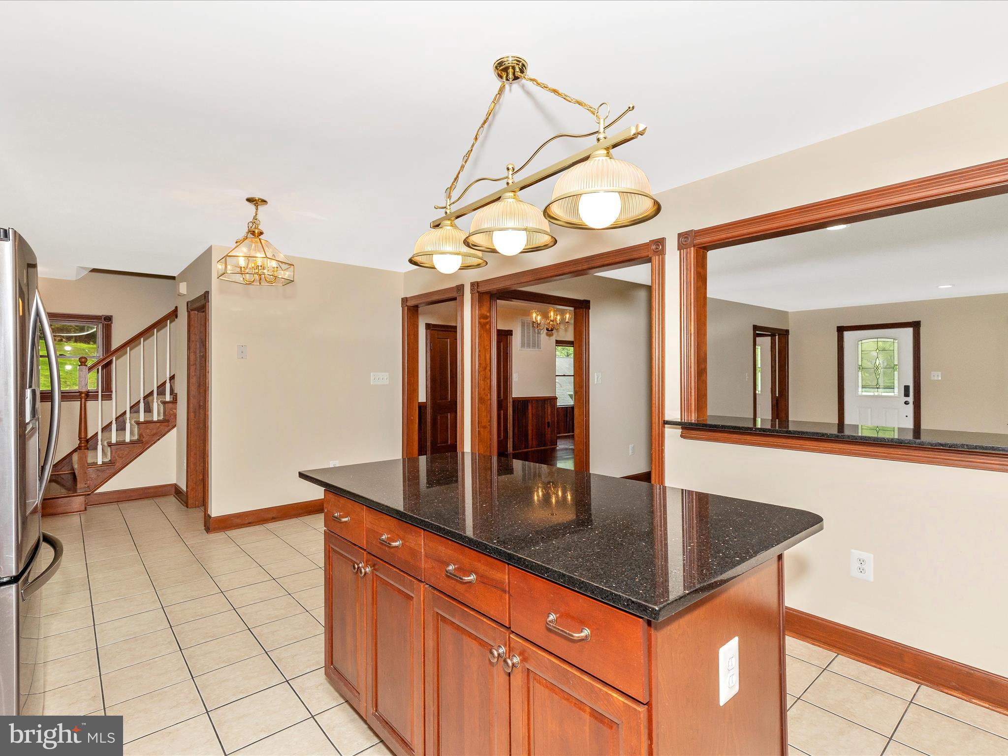 10433 Grindstone Run Road Myersville, MD 21773 - Photo 20 of 42 a kitchen with stainless steel appliances granite countertop a sink a counter space and cabinets