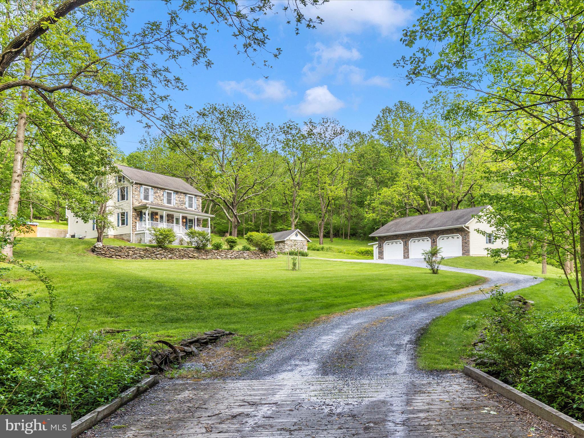 10433 Grindstone Run Road Myersville, MD 21773 - Photo 2 of 42 a front view of a house with garden
