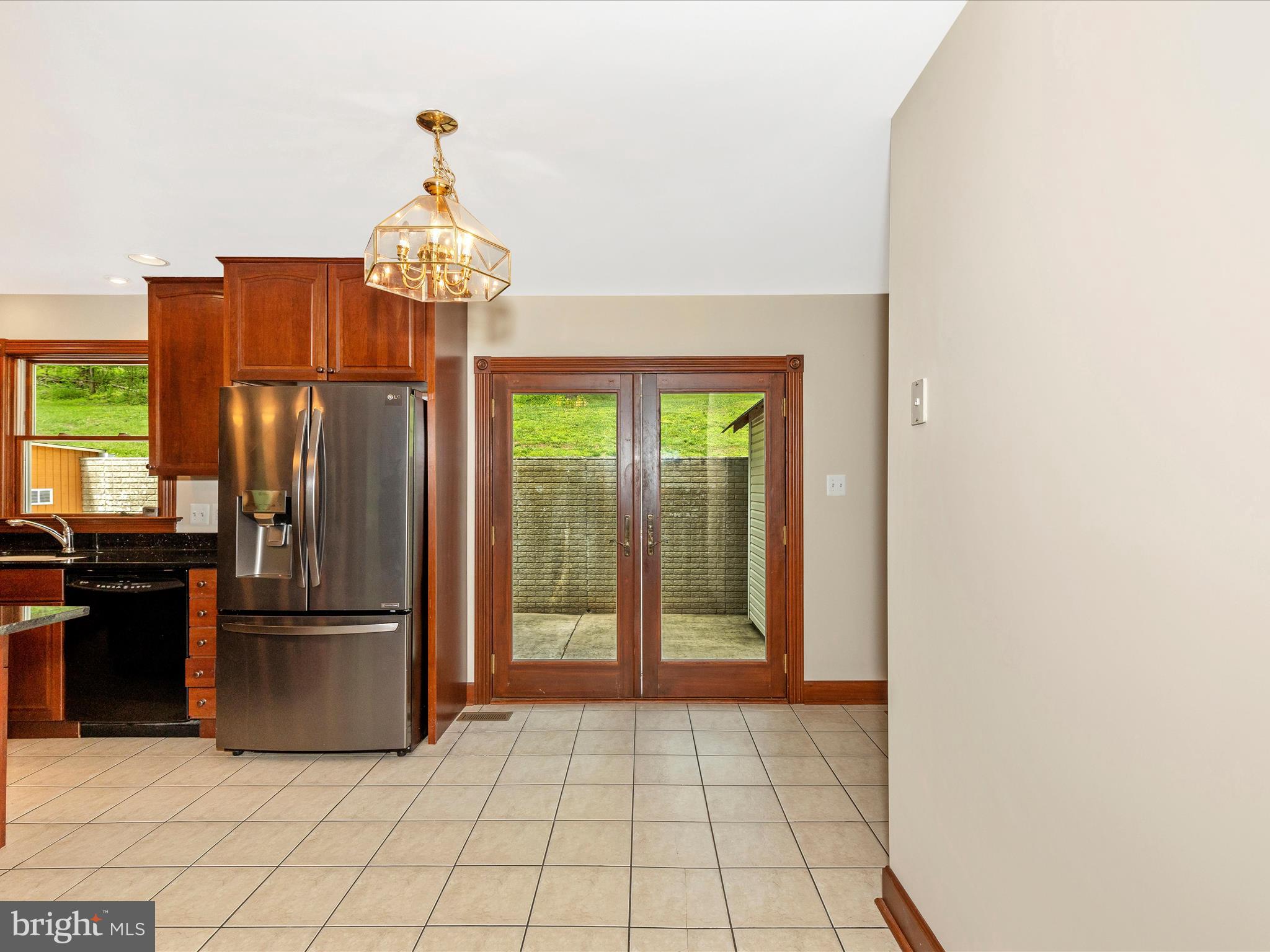 10433 Grindstone Run Road Myersville, MD 21773 - Photo 23 of 42 a kitchen with stainless steel appliances granite countertop a refrigerator and a sink