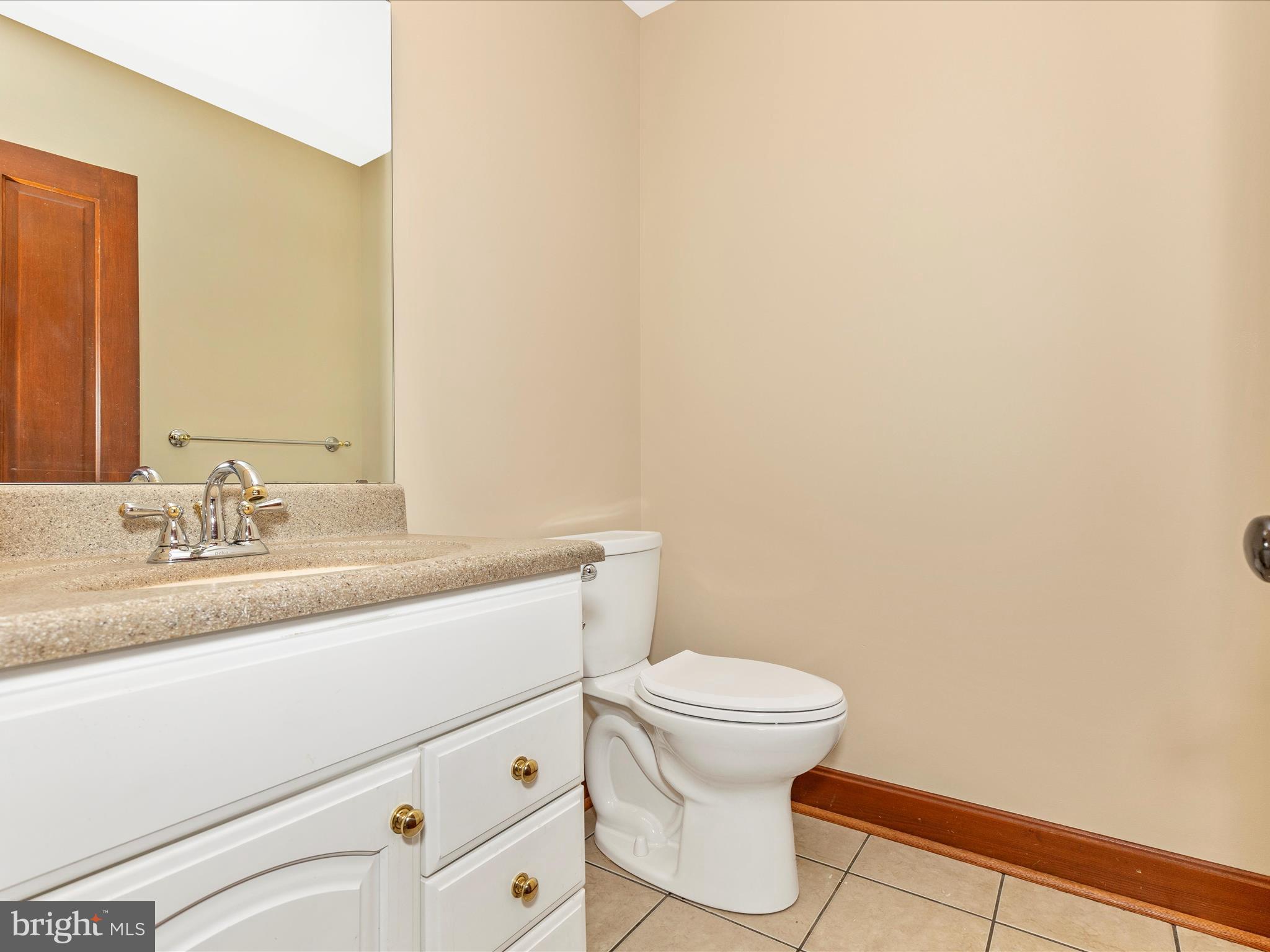 10433 Grindstone Run Road Myersville, MD 21773 - Photo 25 of 42 a bathroom with a sink and a toilet