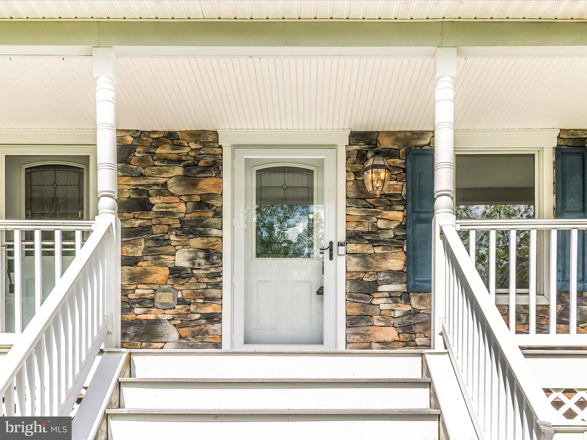 10433 Grindstone Run Road Myersville, MD 21773 - Photo 3 of 42 a view of a balcony with wooden floor and fence