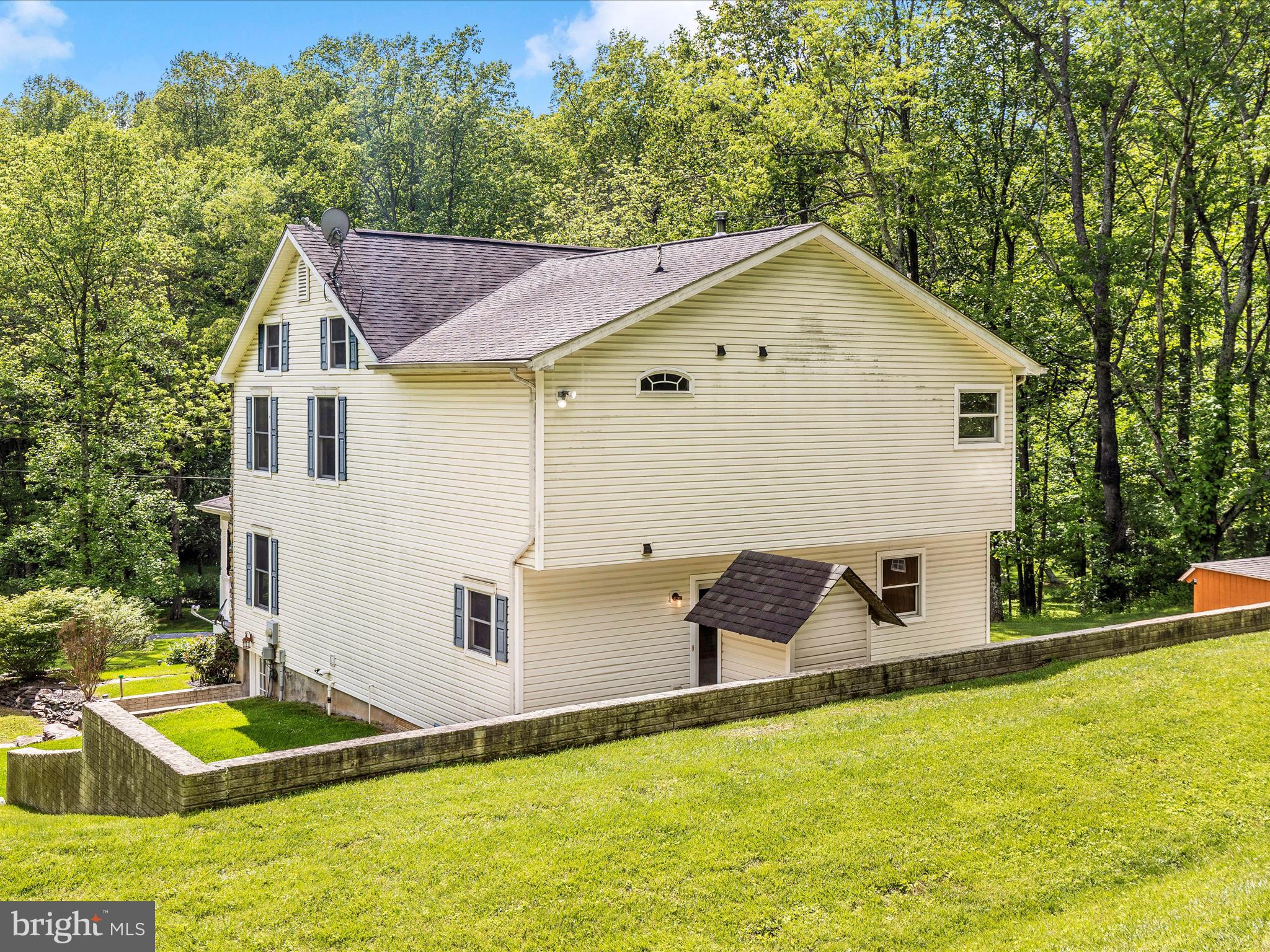 10433 Grindstone Run Road Myersville, MD 21773 - Photo 40 of 42 a front view of house with yard and trees in the background
