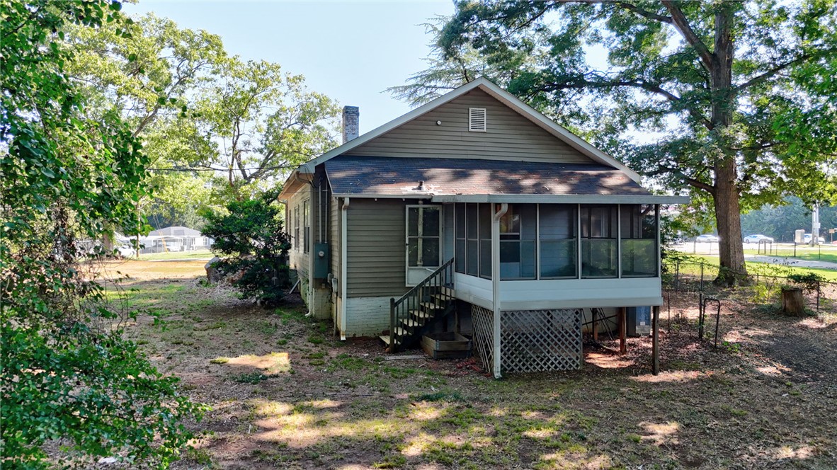 403 Lewis Street Anderson, SC 29624 - Photo 25 of 35 Mature trees shade the rear yard and elevated screened porch of this classic home.