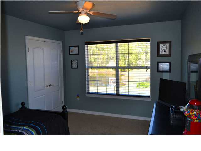 92 Red Bay Court Santa Rosa Beach, FL 32459 - Photo 19 of 19 a bathroom with a black tub next to a window