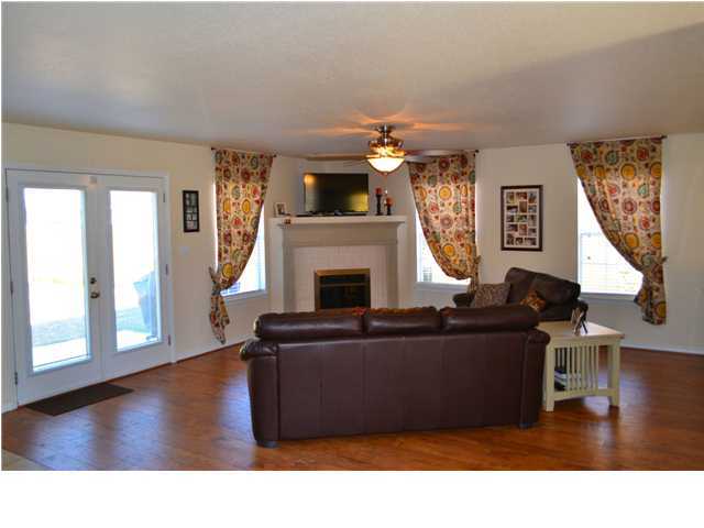 92 Red Bay Court Santa Rosa Beach, FL 32459 - Photo 4 of 19 a living room with furniture and a fireplace