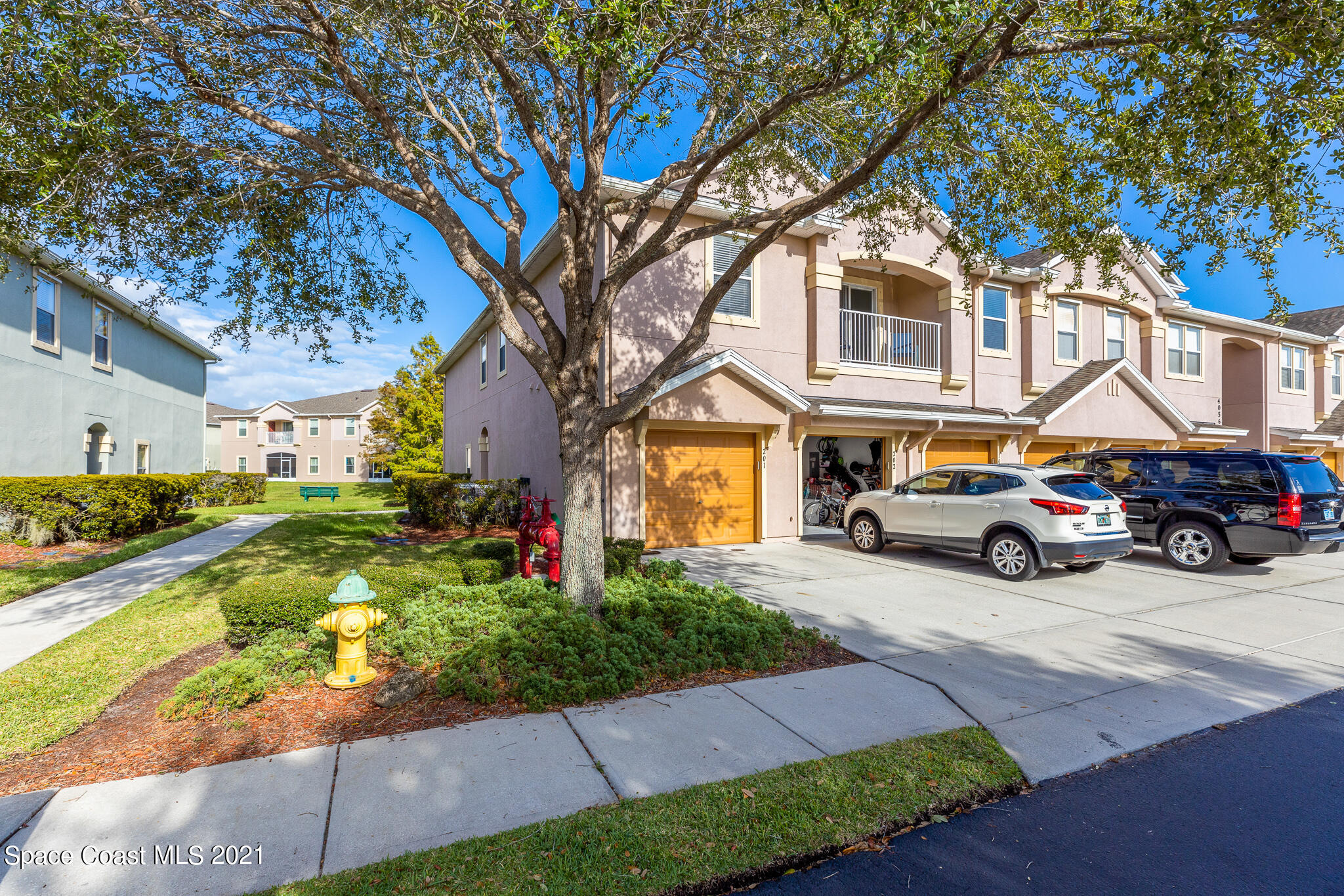 4056 Meander Place, Unit 201 Rockledge, FL 32955 - Photo 1 of 27 a house view with a outdoor space