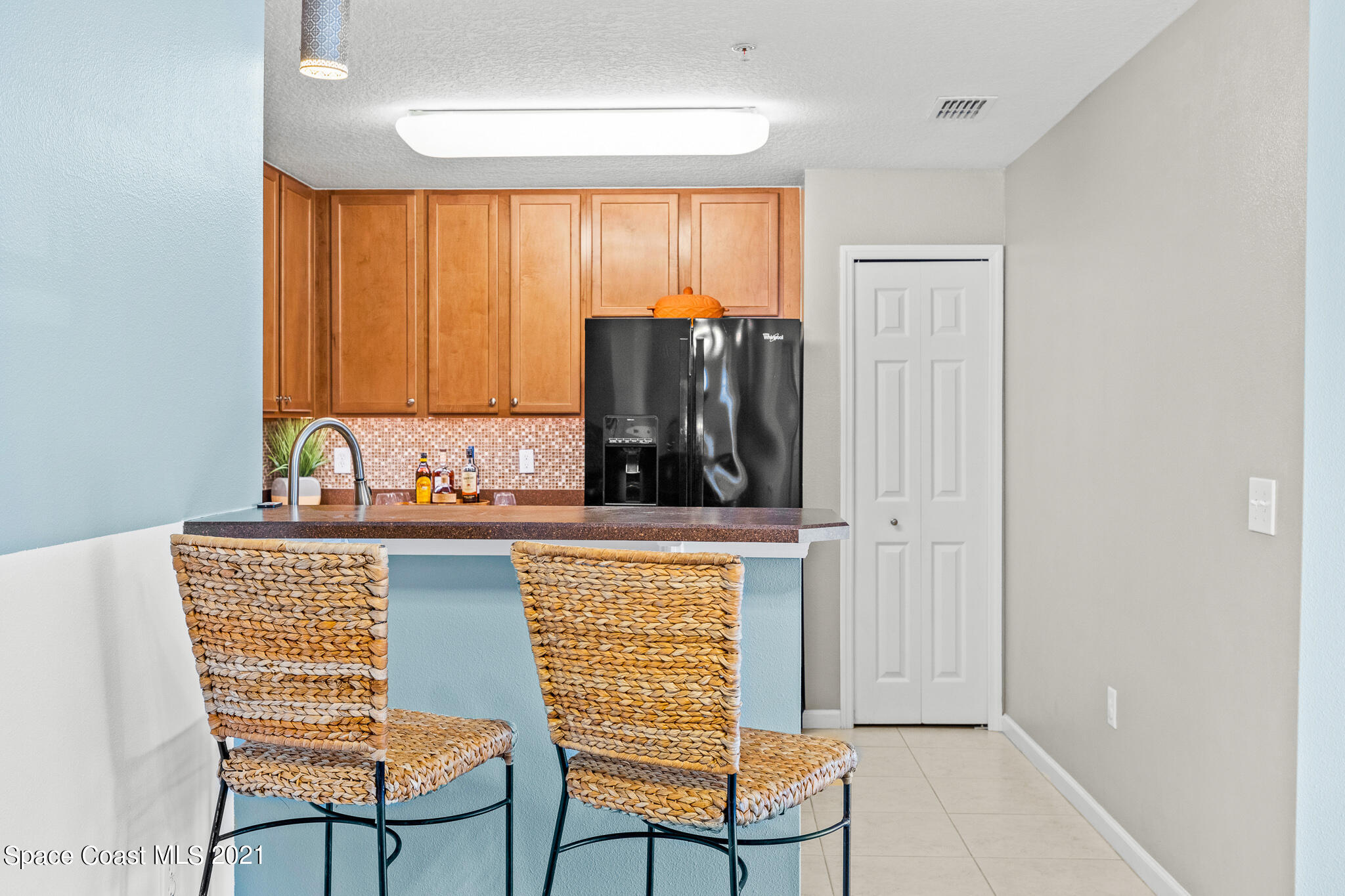 4056 Meander Place, Unit 201 Rockledge, FL 32955 - Photo 12 of 27 a view of a kitchen with furniture and window